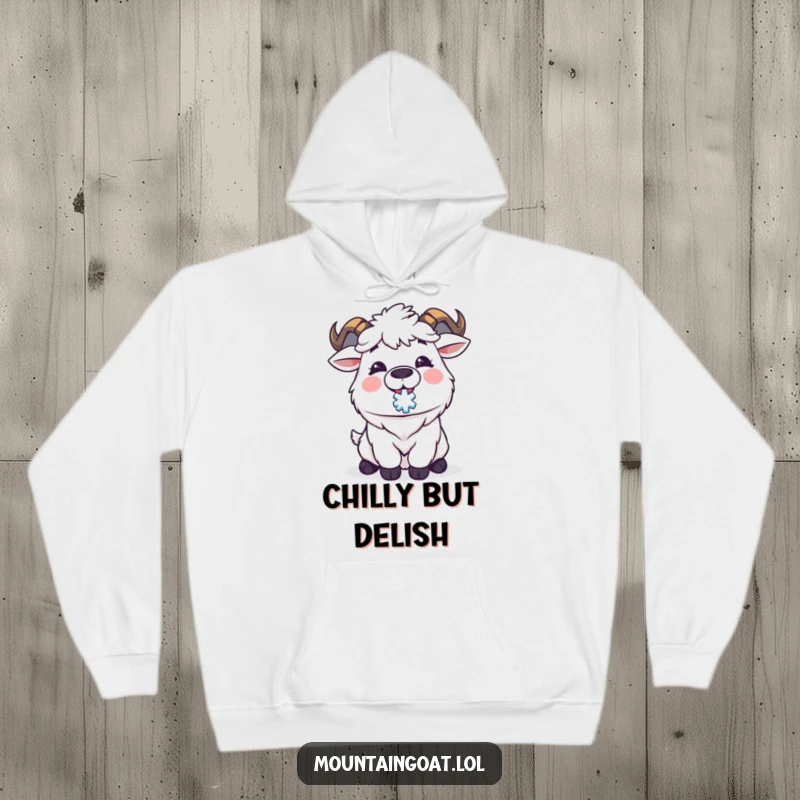 Funny Kawaii mountain goat joyfully catching a snowflake on its tongue, embodying winter's delight. A warm and humorous hoodie.