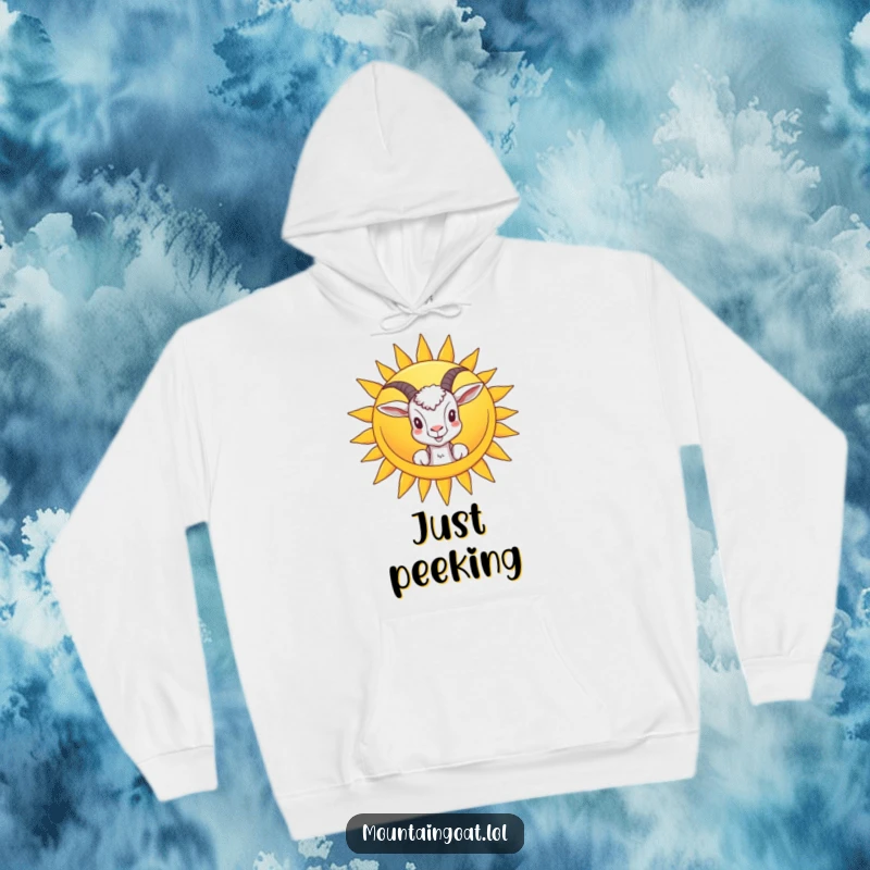 Funny hoodie showcasing a goat peeking from behind a smiling sun, offering warmth and a cheerful, humorous visual.