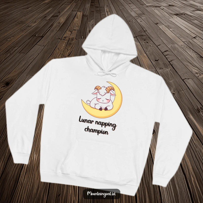 Funny hoodie showcasing a mountain goat napping on a crescent moon, offering a humorous and warm embrace.