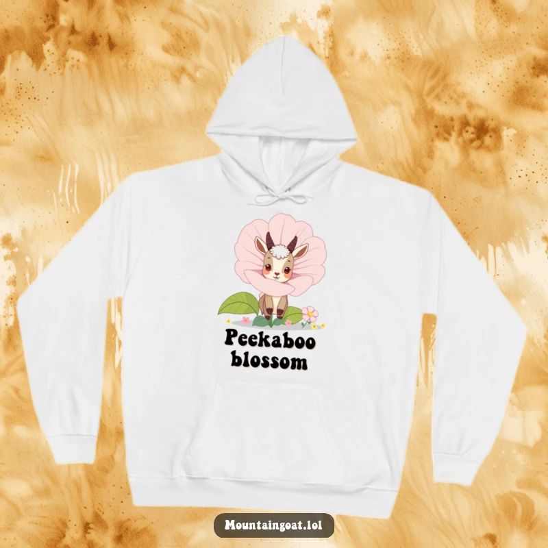 Funny mountain goat peeking from behind a large blooming flower, depicted on a warm, comfortable hoodie. Whimsical and snug.