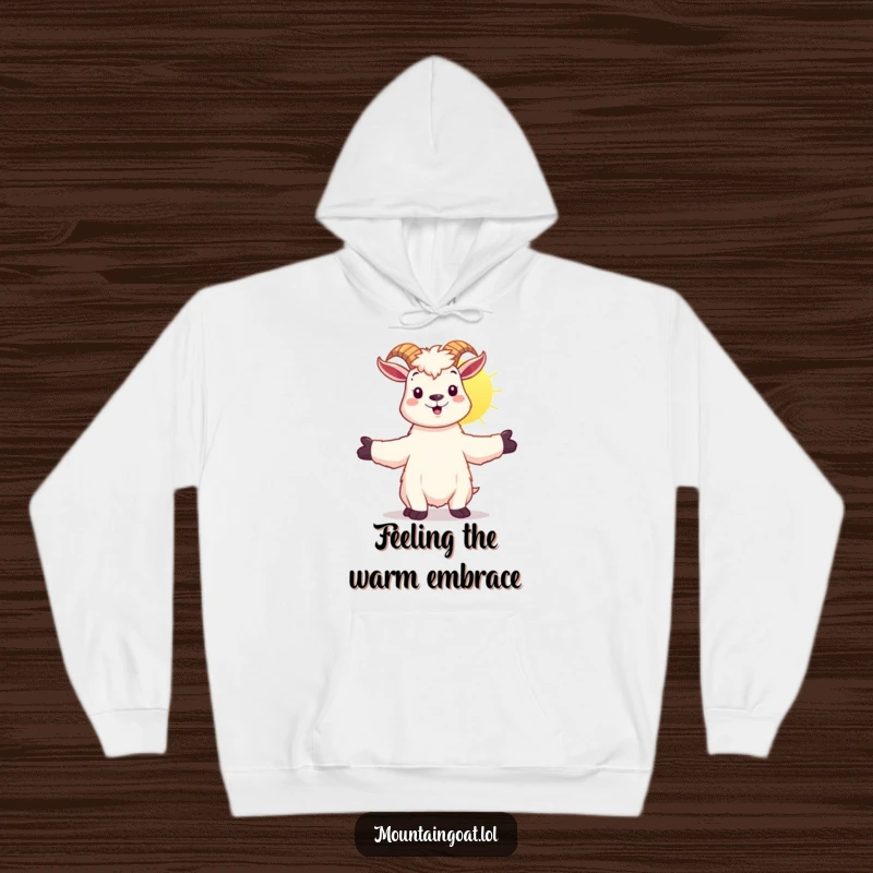 Funny kawaii mountain goat with arms outstretched, embracing sunshine, on a cozy, warm hoodie.