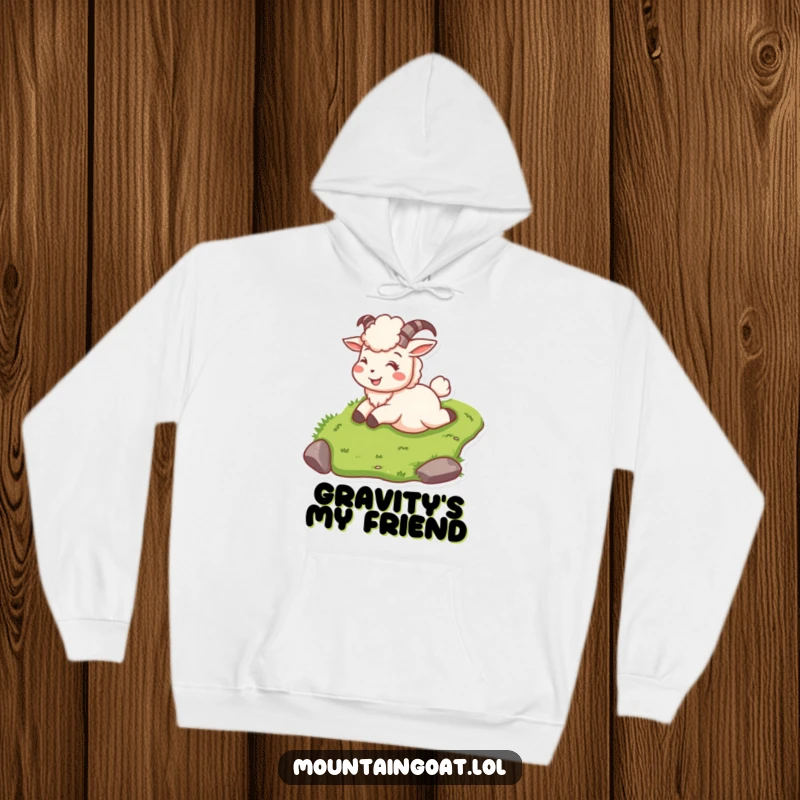 Funny mountain goat on a hoodie, sliding down a grassy slope with a happy, carefree smile.