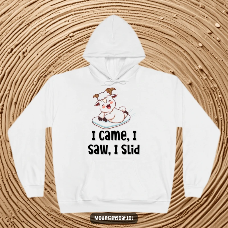 Funny Hoodie: A delighted mountain goat belly slides down a snow-covered hill, capturing winter's playful spirit.