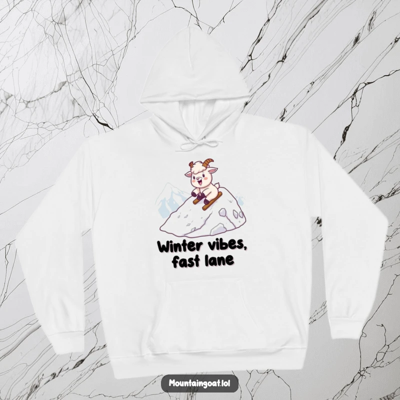 Funny kawaii mountain goat sliding down a snowy mountain, featured on a cozy and warm hoodie.