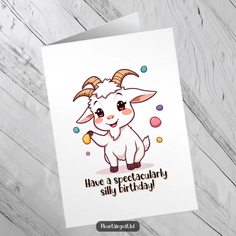 Funny Free Printable Birthday Card: A goat with a silly face juggles colorful pebbles, bringing cheer for a birthday. Downloadable.