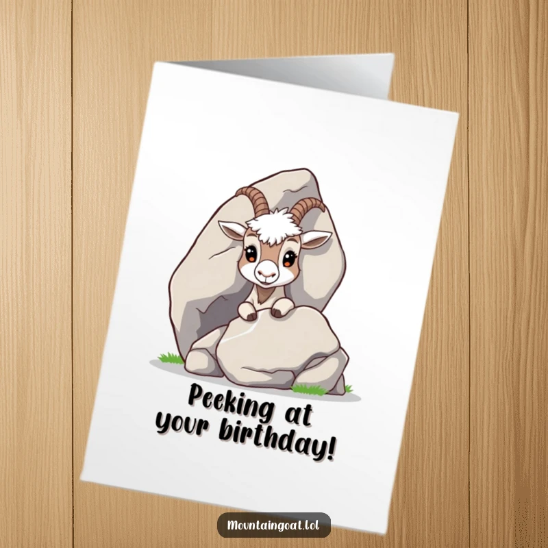 Curious Free Printable Birthday Card: A shy mountain goat peeking with wide eyes from behind a large, smooth rock.