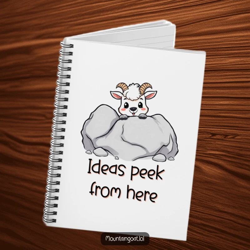 Funny kawaii mountain goat peeking mischievously from behind a boulder, on the cover of a lined notebook.