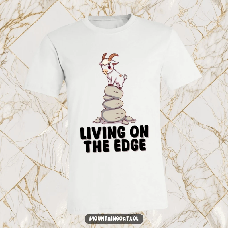 Funny mountain goat t-shirt featuring a goat attempting to balance on a shaky pile of pebbles, capturing a moment of comical instability.