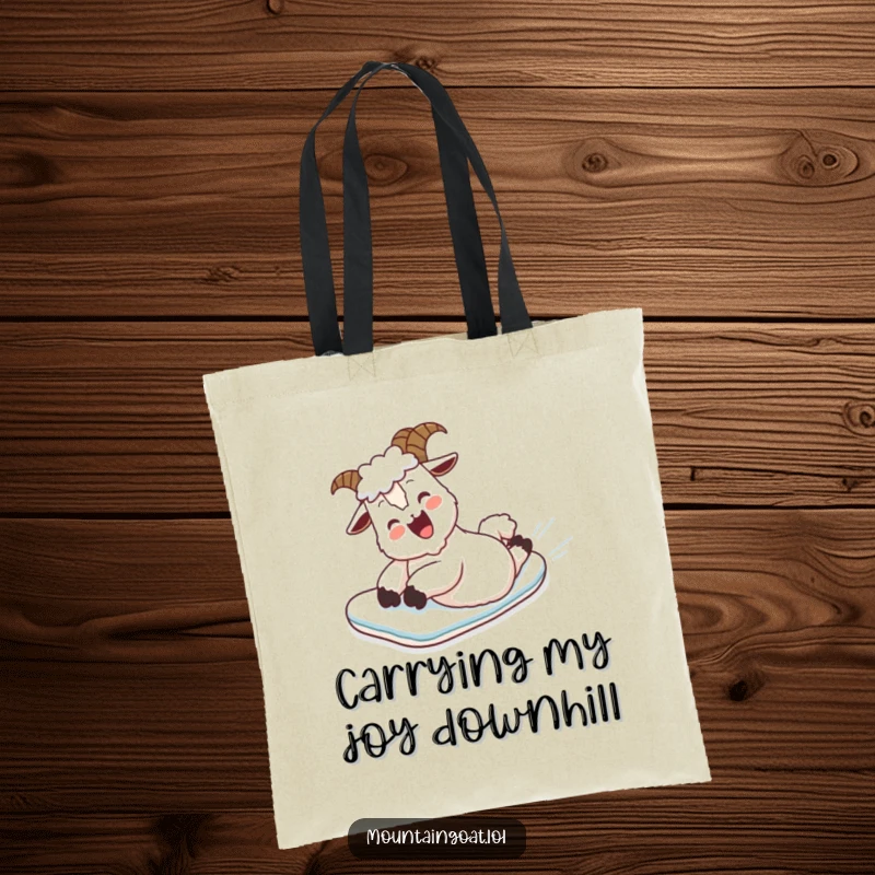 Funny Tote Bag: A happy mountain goat is pictured mid-belly slide down a snowy slope, bringing outdoor humor.
