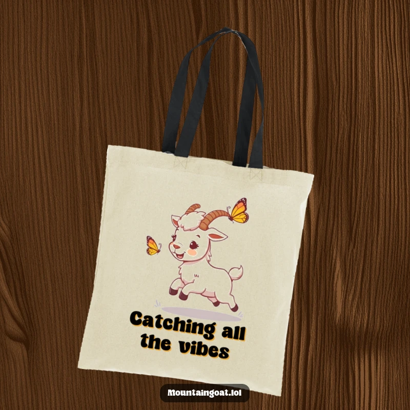 Funny mountain goat tote bag showing a playful character chasing a butterfly, perfect for carrying essentials with a touch of whimsy.