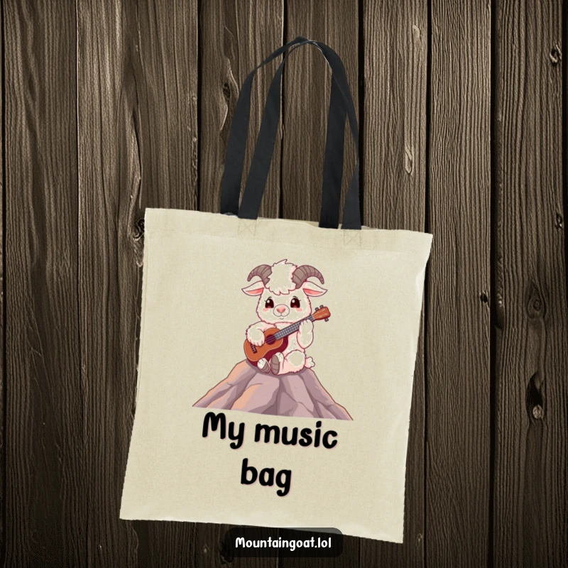 Funny fluffy mountain goat playing a ukulele on a peak, a cute and functional tote bag for music lovers.