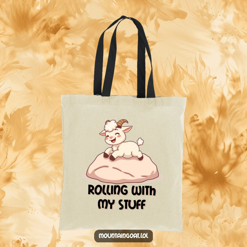 Funny kawaii mountain goat giggling while rolling down a hill, on a durable tote bag.